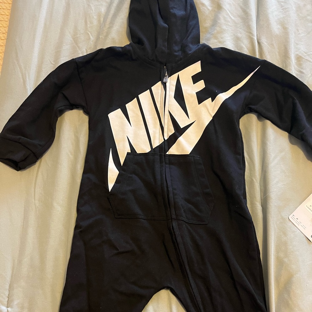 Black hoodie with white Nike logo. NWT Front pocket